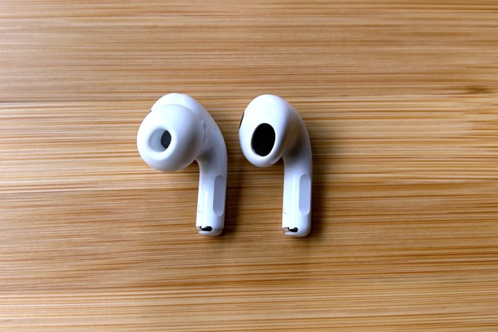 Apple AirPods Pro 2 next to an Apple AirPods 3 earpiece.