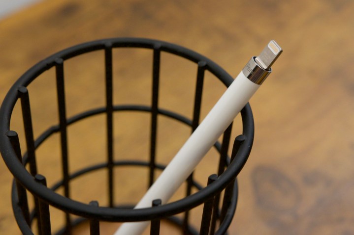 An Apple Pencil with its charging cap off.