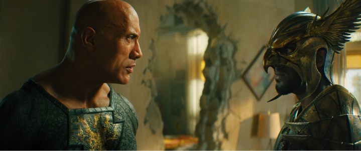 Dwayne Johnson stares at Aldis Hodge in a scene from Black Adam.