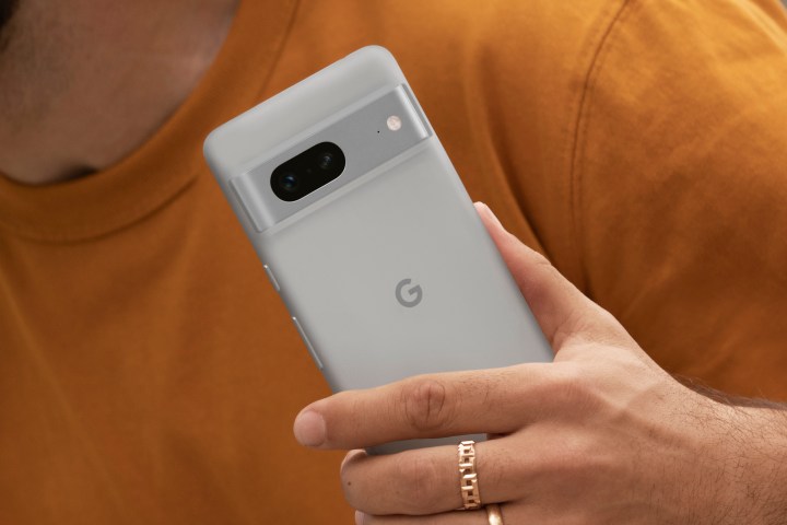 Someone holding a white Google Pixel 7.