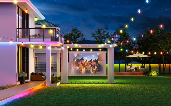 Govee Outdoor String Lights set in a back yard over a projector screen. 