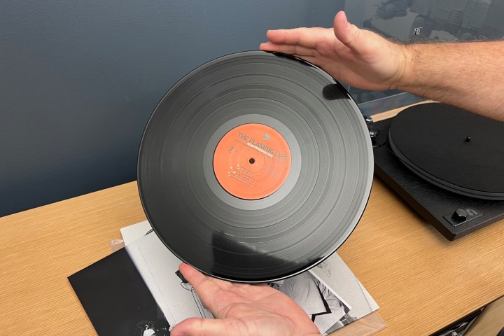 How to properly hold a vinyl record without touching the surface.