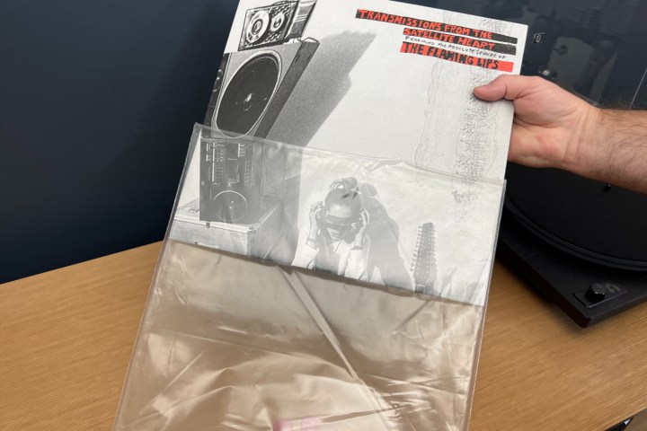 Removing a record from the plastic outer sleeve.