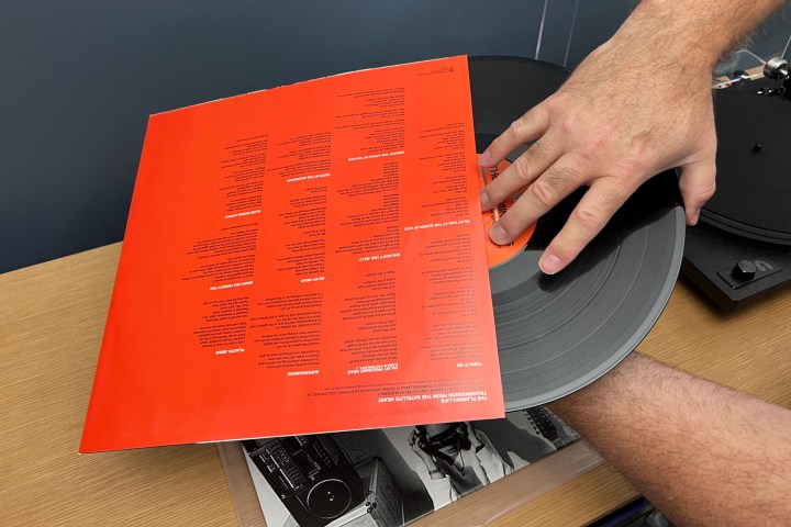 Removing the record from the inner sleeve.