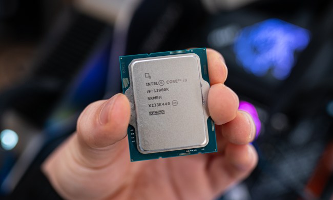 Intel Core i9-13900K held between fingertips.