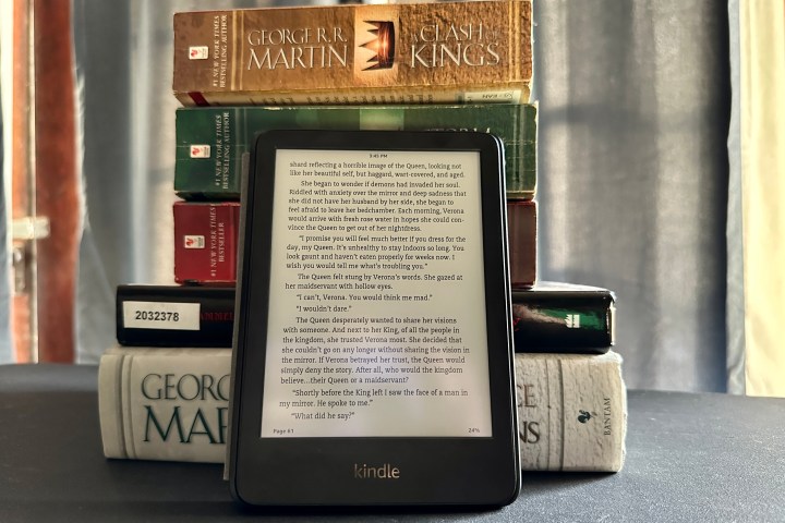 Amazon Kindle (2022) in front of book stack