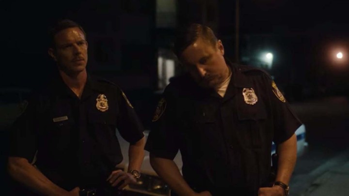 Two police officers in Monster: The Jeffrey Dahmer Story.