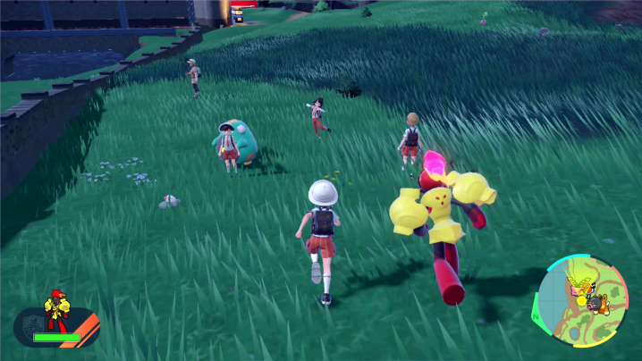 Pokemon trainers run around with their monsters in Pokemon Violet and Scarlet.