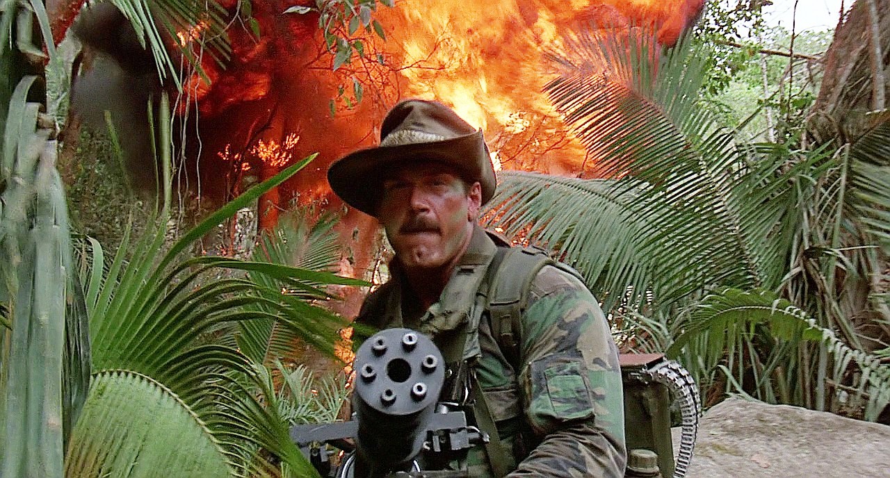 Jesse Ventura aims a gun in Predator.