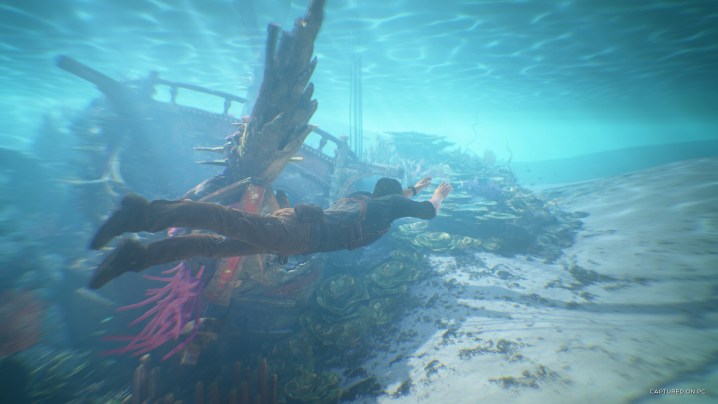 Nathan Drake swimming under water in Uncharted 4.
