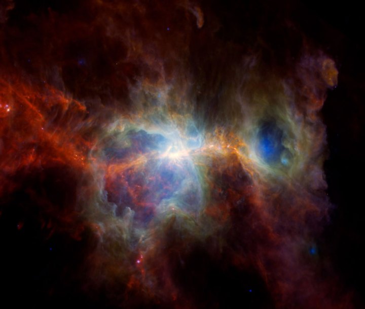 This infrared image of the Orion Nebula features plenty of dust but no stars. In these infrared wavelengths, it’s possible to see hot spots where new stars are forming, while unseen bright, massive stars have carved out caverns of empty space.