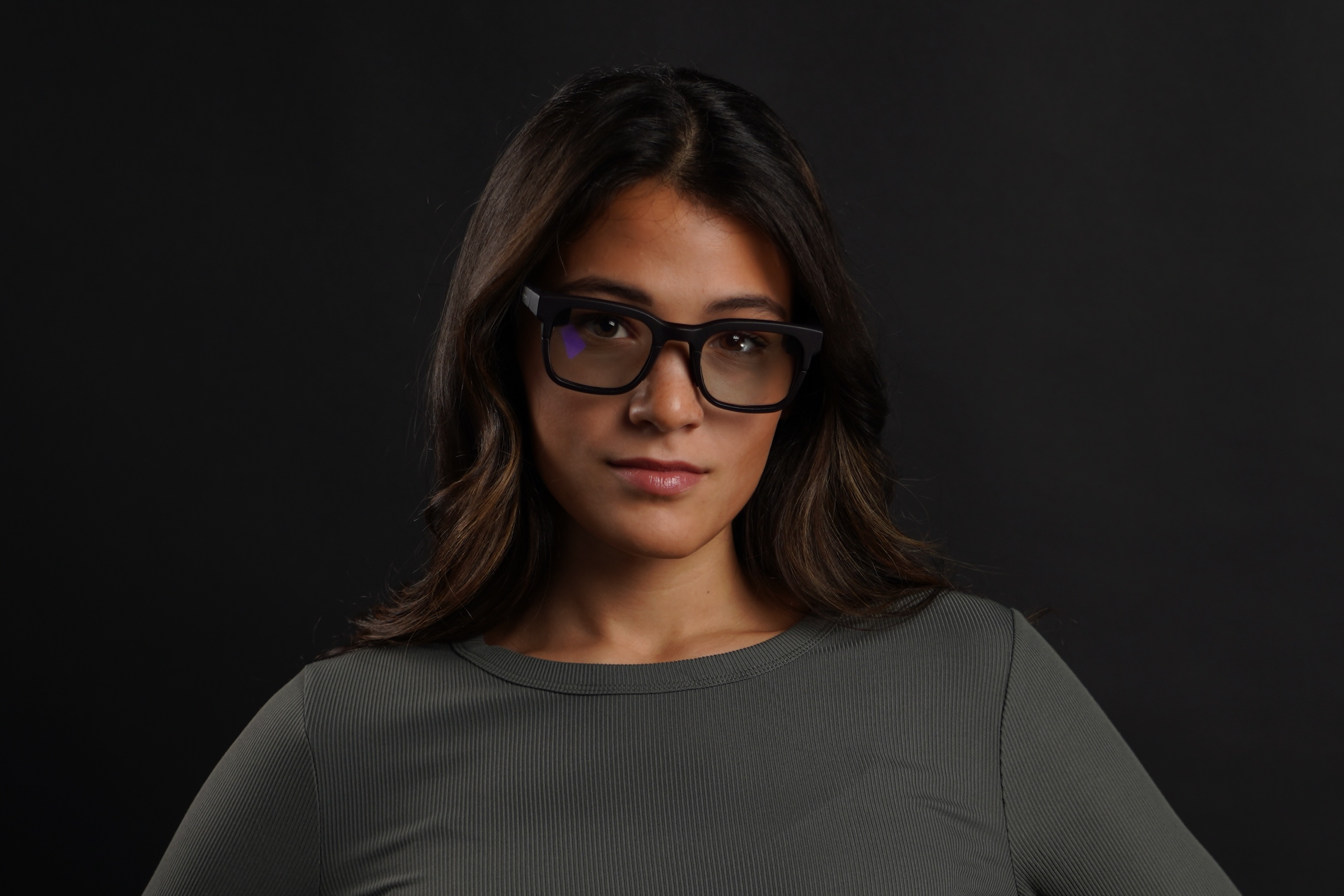 A woman wears Vuzix Ultralight AR glasses.