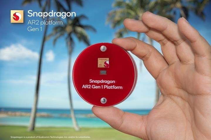 A Qualcomm Snapdragon AR2 Gen 1 chip case is held in hand.
