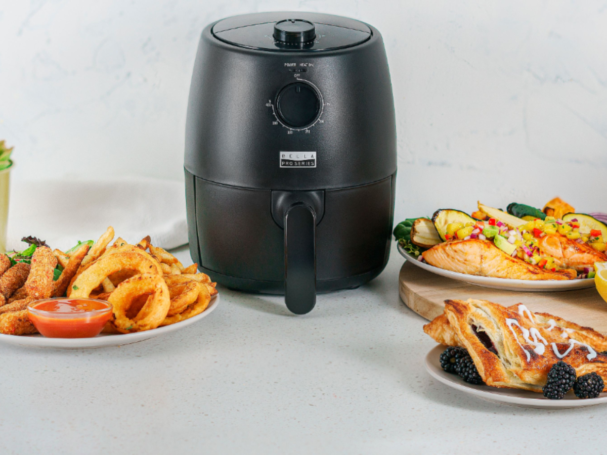 https://www.digitaltrends.com/wp-content/uploads/2022/11/Bella-Pro-Series-2-quart-analog-air-fryer-on-a-counter-with-several-dishes-of-cooked-food.jpg?fit=720%2C540&p=1
