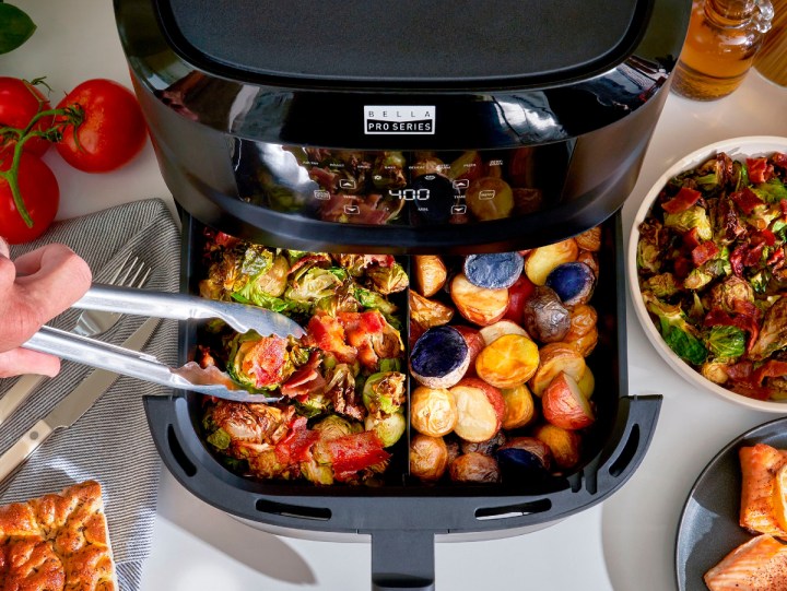 Bella Pro Series 8-quart Digital Air Fryer with Divided Basket with different snacks cooking in each basket layer.