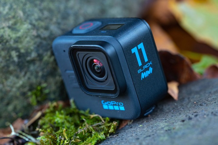 The GoPro Hero 11 Mini on a rock with moss.