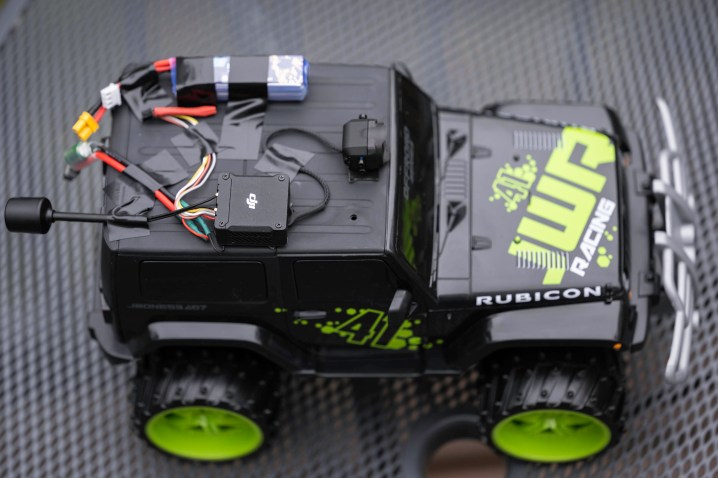 The DJI O3 Air Unit on top of a RC monster truck.