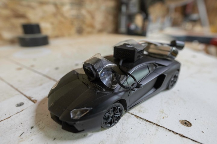 The DJI O3 Air Unit taped to the top of an RC Car.