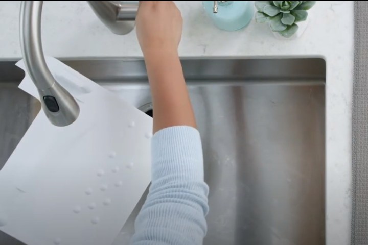 Drip Tray Cleaning by sink.