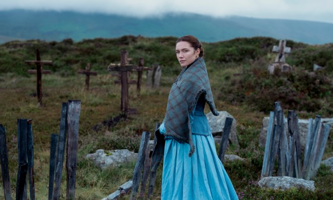 Florence Pugh stands near a makeshift graveyard in The Wonder.