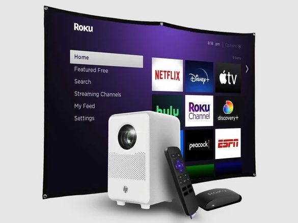 The HP CC200 projector with accessories and a projected Roku home screen.