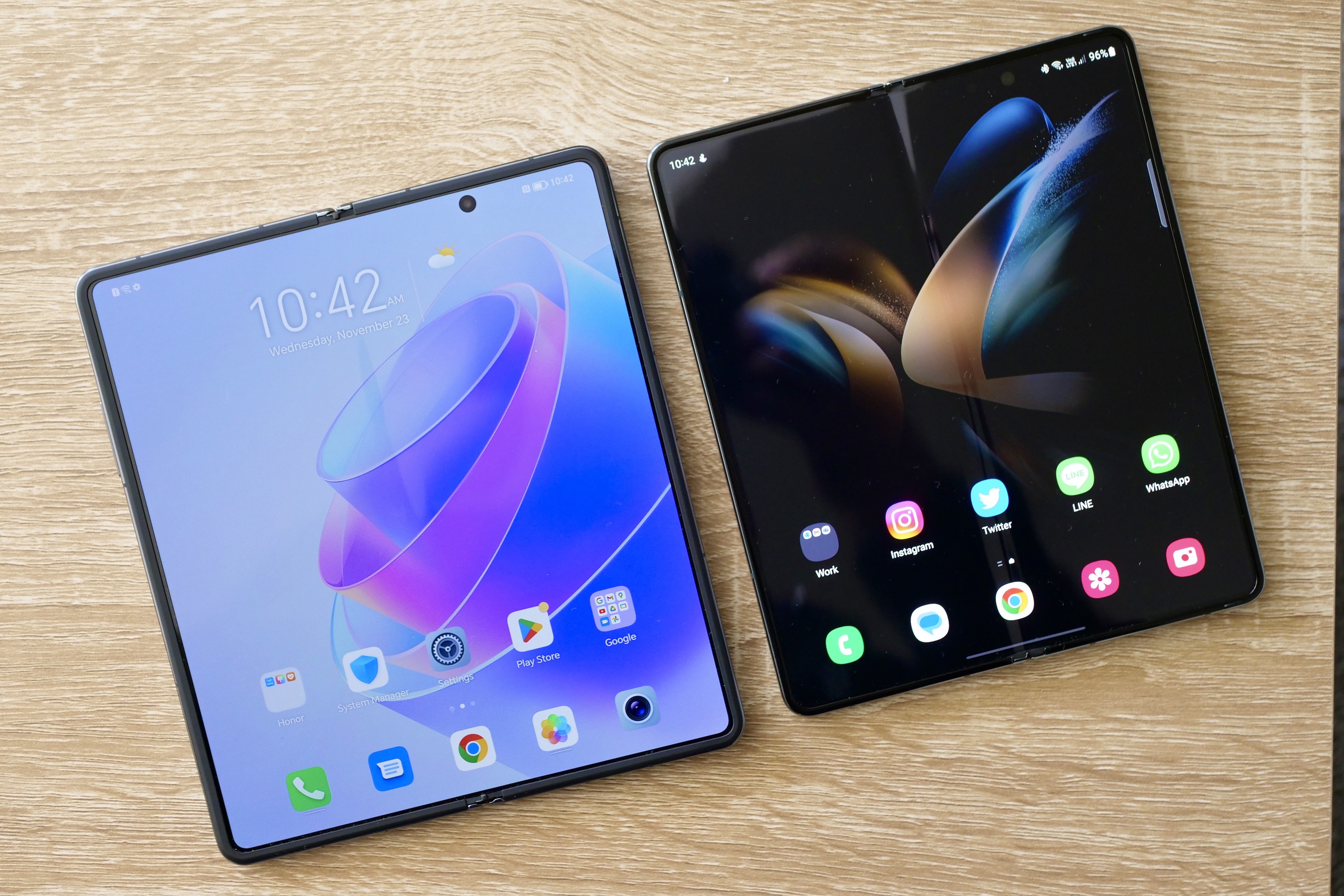 Honor Magic Vs and Galaxy Z Fold 4 with open screens.