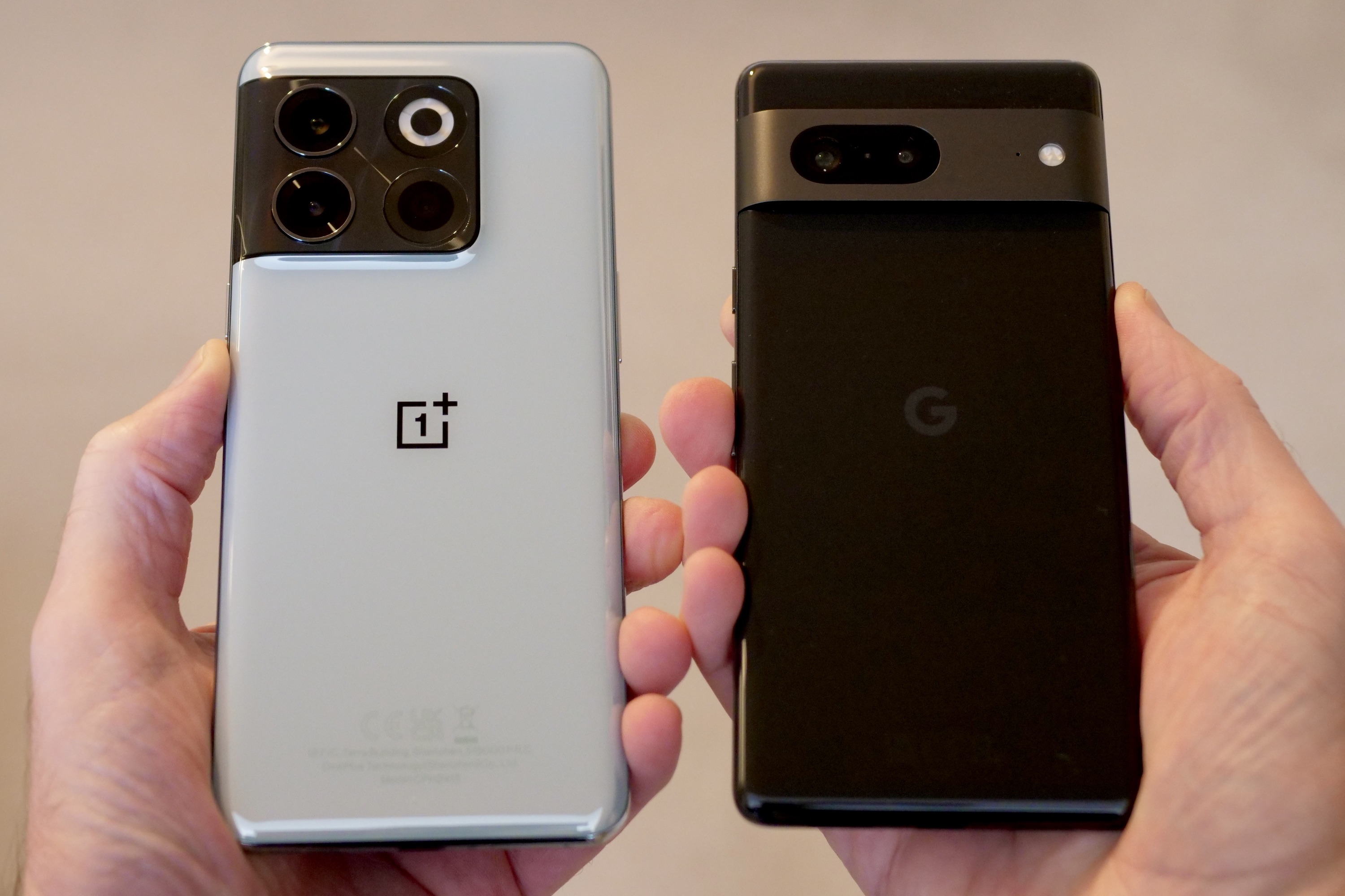 Google Pixel 7 and OnePlus 10T seen from the back.