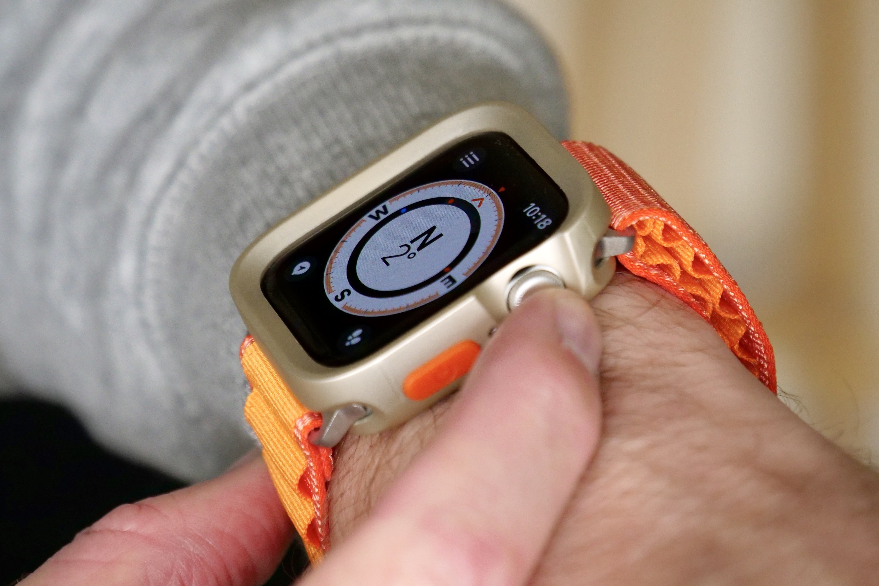 Apple Watch SE 2 with protective case and generic Alpine Loop-style strap.