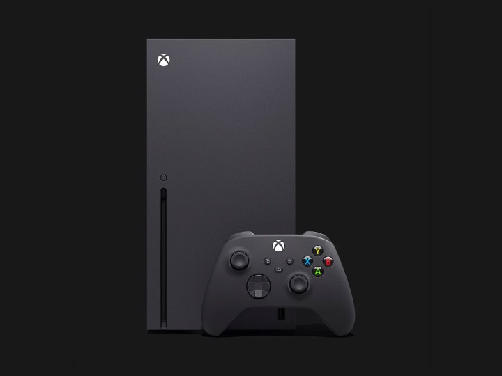 A black Xbox Series X and controller against a black background.