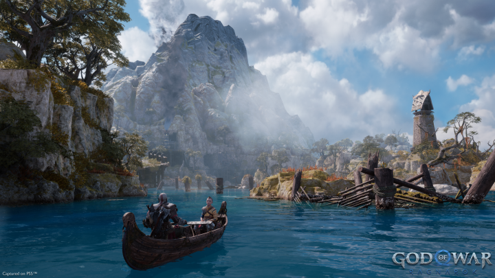 Kratos and Atreus sail on water in God of War Ragnarok.