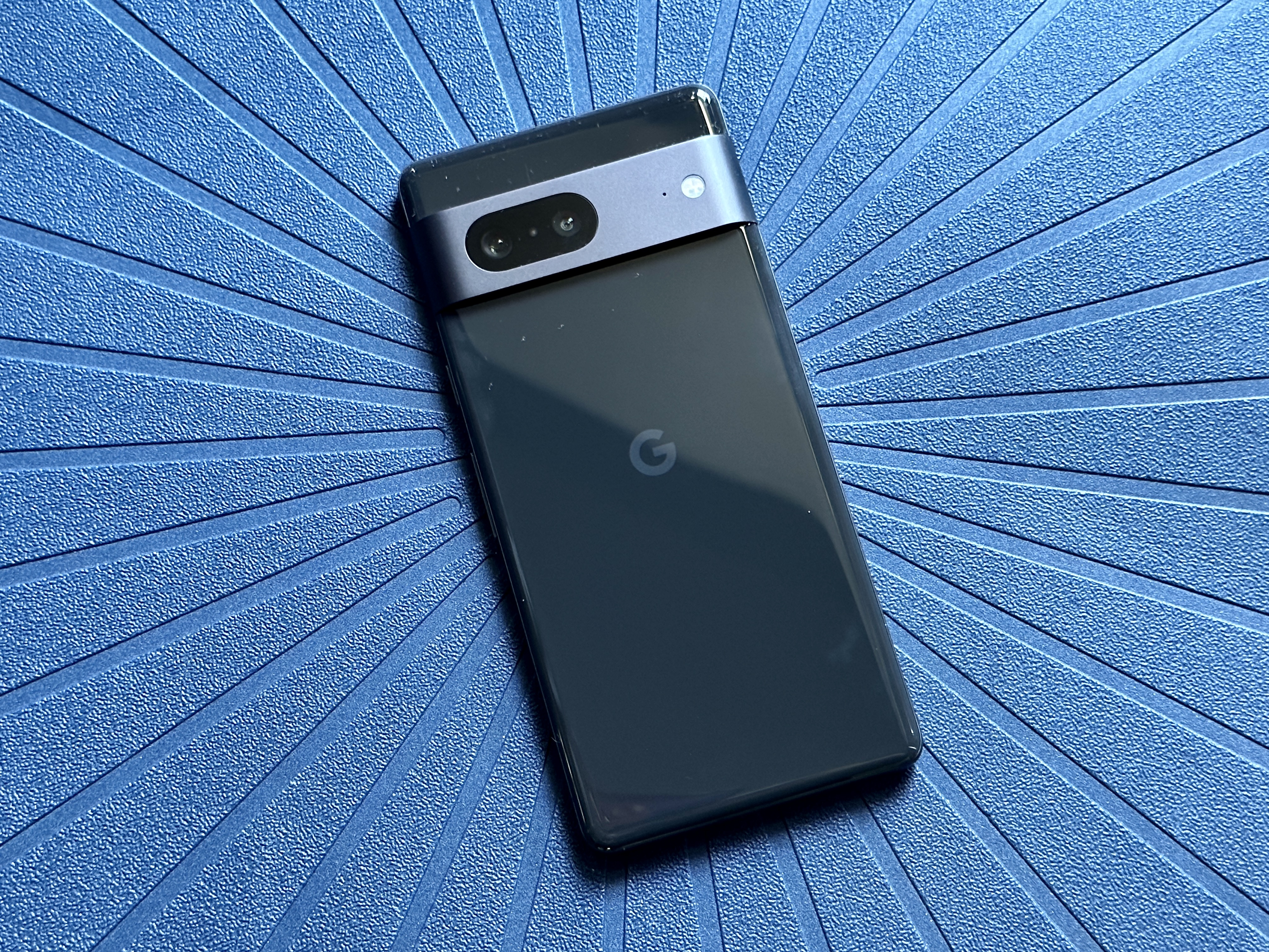 Back of an obsidian black Google Pixel 7.