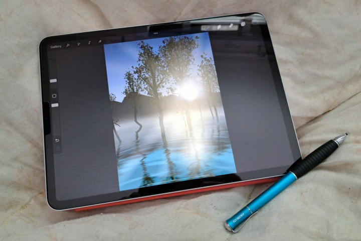 An iPad shows art made with Procreate and a Meko Stylus.