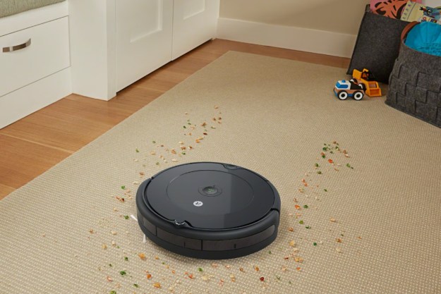 iRobot Roomba 694 Wi-Fi Linked Robotic Vacuum cleaning up spilled cereal.