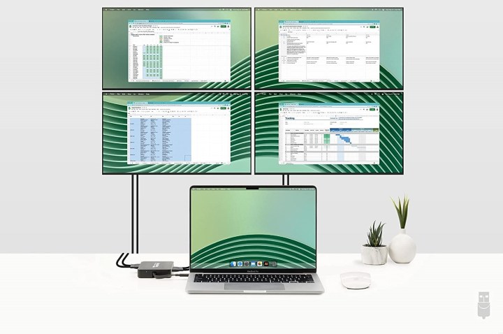 Apple MacBook with four additional monitors added.