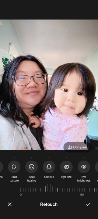 Editing a selfie of Christine and her daughter in OnePlus Nord N300 5G photo editing app with retouch tools