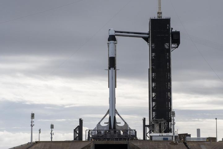 A SpaceX Falcon 9 rocket, with the company’s Dragon cargo spacecraft atop, is raised to a vertical position at NASA Kennedy Space Center’s Launch Complex 39A on Nov. 21, 2022, in preparation for the 26th commercial resupply services launch to the International Space Station.