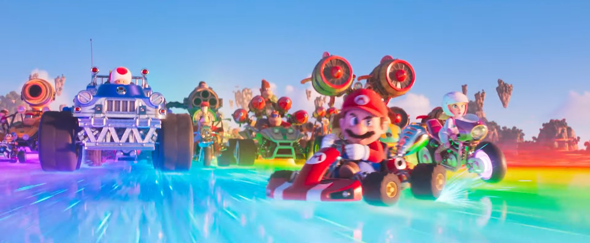 Mario e seus amigos correm pela Rainbow Road em The Super Mario Bros. Movie.