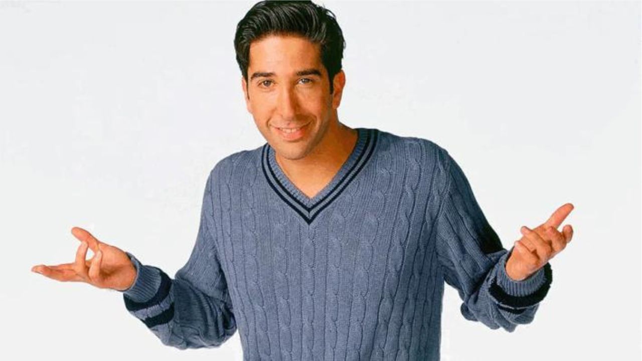 Promo photo for Friends showing Ross Geller smiling and shrugging.
