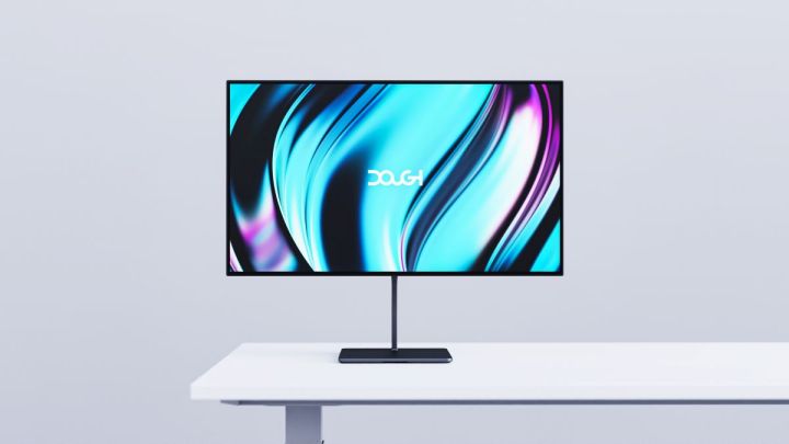 The new Dough Glossy OLED Gaming Monitor on a white table.