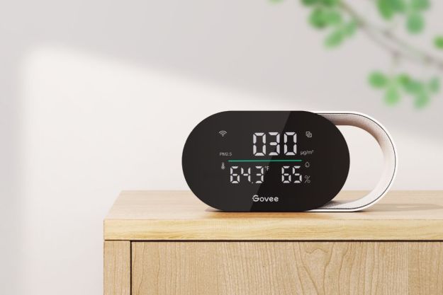 The Govee Smart Air Quality Monitor sitting on a wooden stand.
