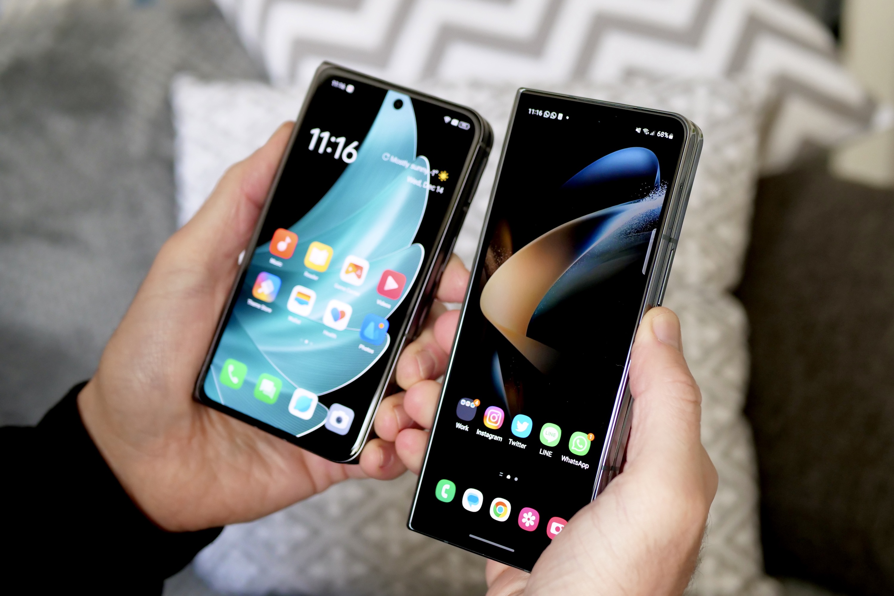 Oppo Find N2 and Galaxy Z Fold 4 with closed screens held in a person's hands.
