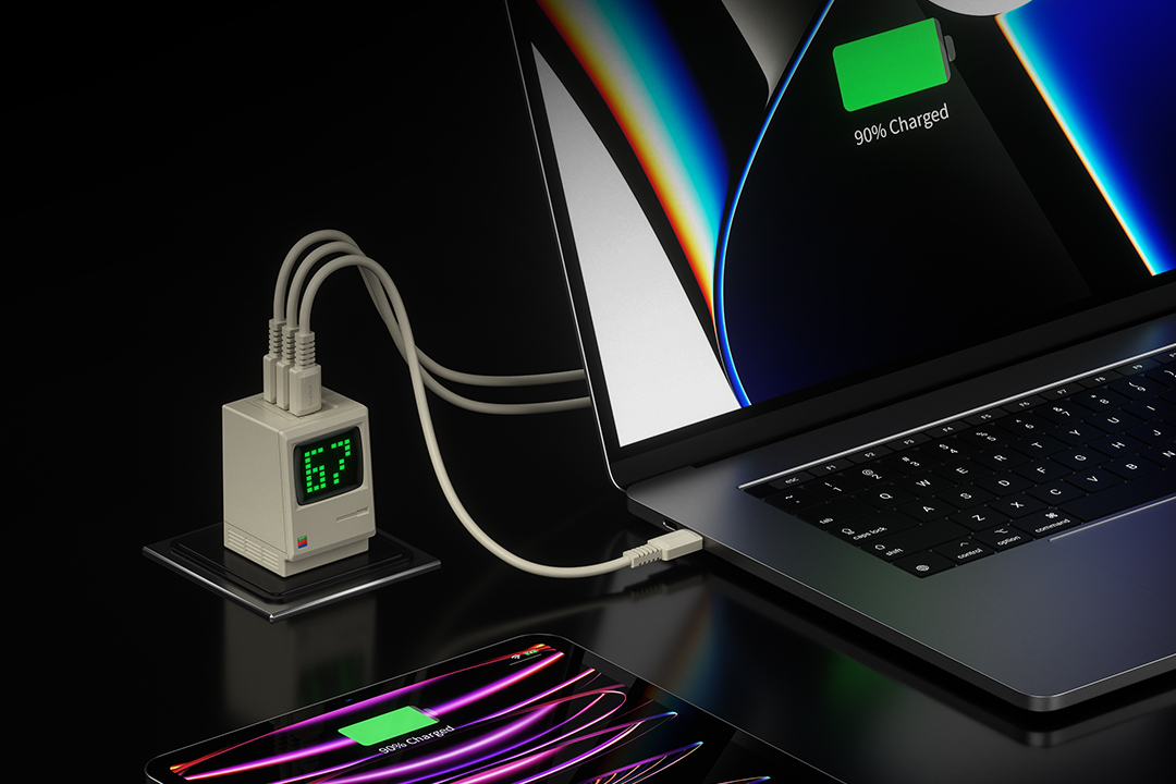 The Shargeek Retro 67 charger powing up a MacBook Pro and an iPad.