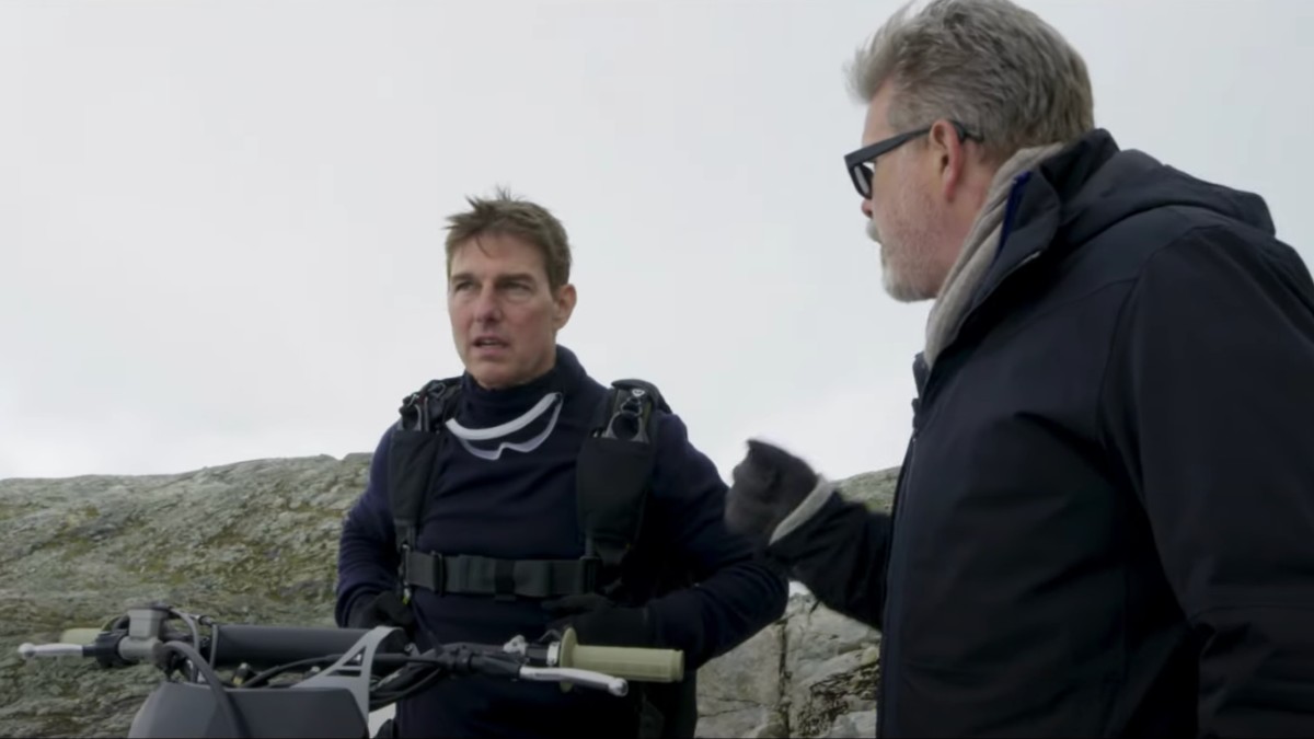 Tom Cruise talks with Christopher McQuarrie on the set of Mission: Impossible 7.