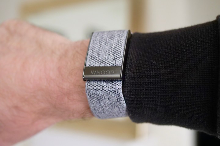 The front of the Whoop 4.0 on a person's wrist.