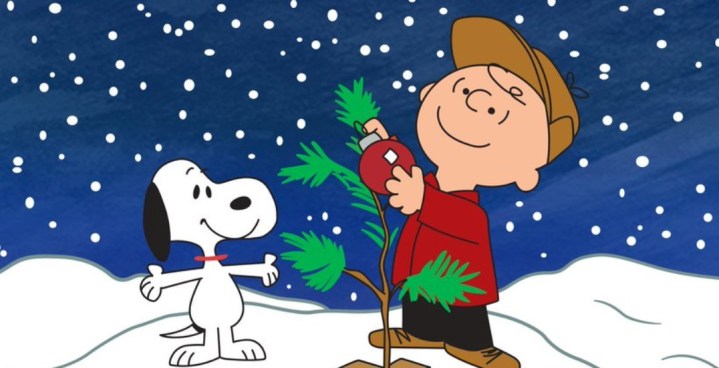 Charlie Brown and Snoopy decorating a tree in A Charlie Brown Christmas.