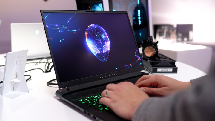 Someone typing on the Alienware m18 laptop.