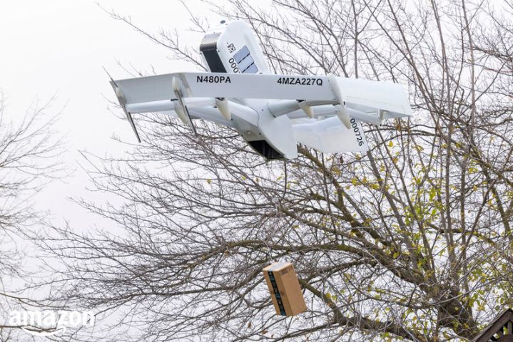 Amazon's delivery drone carrying a package.