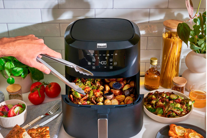 Making two different vegetable dishes in the divided basket of the Bella Pro Series Digital Air Fryer.
