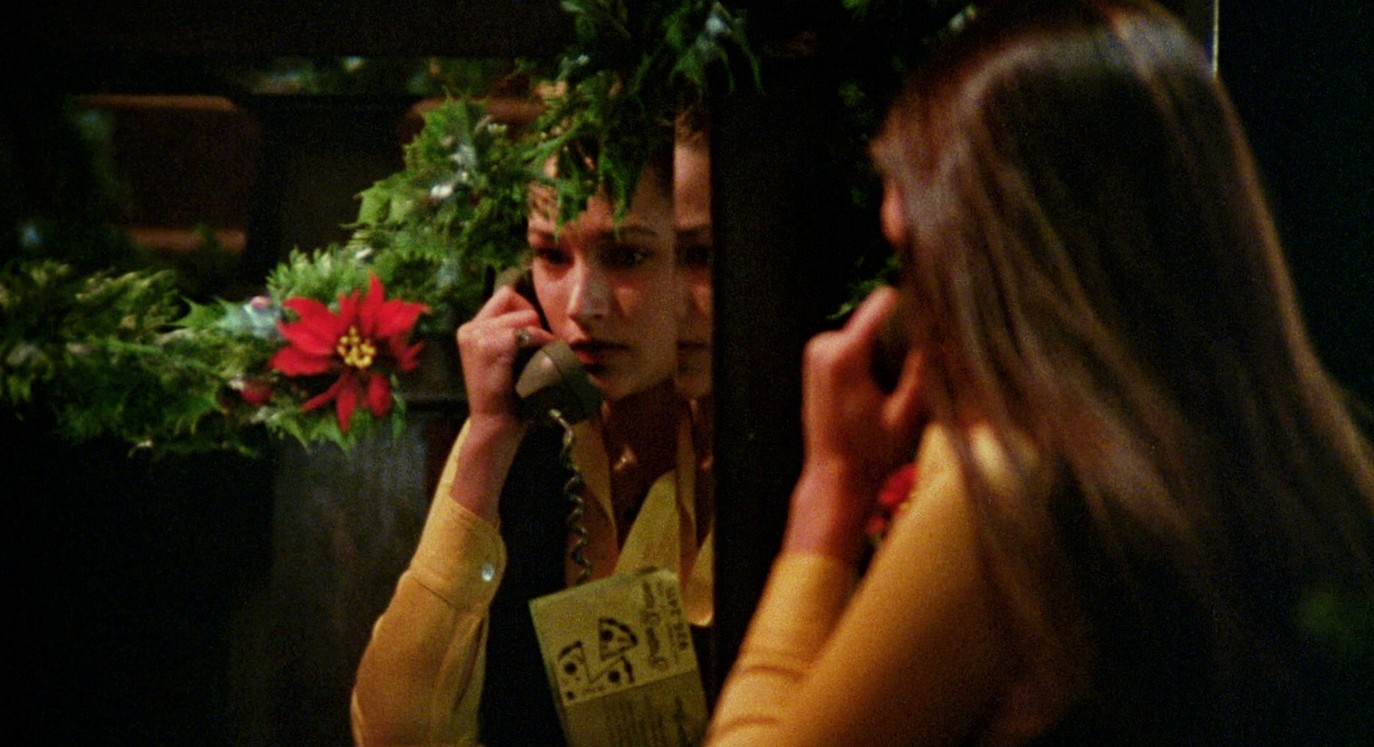 A girl talks on the phone in Black Christmas.