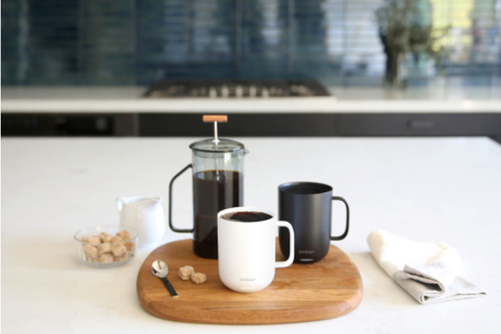 Two Ember Smart Mug 2's on a tray with a cafetiere.